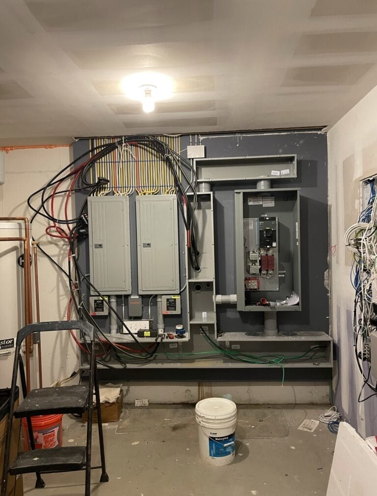 Electrical panel setup in a utility room with various cables and equipment in home near Dunedin FL