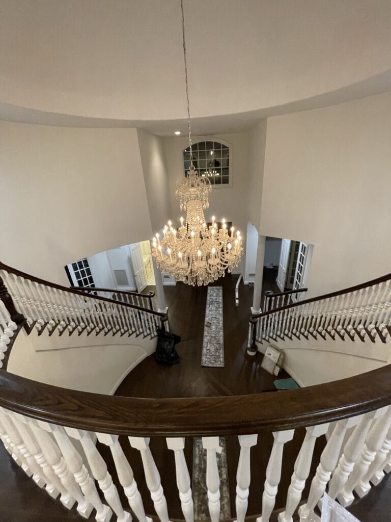 A grand foyer with a large crystal chandelier near Dunedin FL